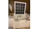 Relaxing soaking tub in a stylish bathroom with a large window and neutral decor at 187 Pine Branch Dr, Stockbridge, GA 30281