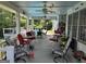 Inviting covered patio with comfortable seating, ceiling fans, and views of the refreshing pool at 187 Pine Branch Dr, Stockbridge, GA 30281