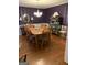 Dining room with wood floors, chandelier, and a classic china cabinet at 187 Pine Branch Dr, Stockbridge, GA 30281