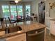 Kitchen featuring granite counters and a view into the breakfast nook and sun room at 187 Pine Branch Dr, Stockbridge, GA 30281