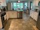 Spacious kitchen featuring stainless steel appliances, granite counters, and ample cabinet space, perfect for cooking at 187 Pine Branch Dr, Stockbridge, GA 30281