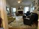 Comfortable living room includes a fireplace, large windows, and stylish furnishings, creating a relaxing ambiance at 187 Pine Branch Dr, Stockbridge, GA 30281