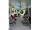 Inviting outdoor porch with various seating arrangements and view of backyard pool at 187 Pine Branch Dr, Stockbridge, GA 30281