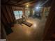 An unfinished basement featuring exposed framing, a treadmill, and workout equipment at 5470 Hilltop Pass, Fairburn, GA 30213