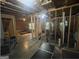 An unfinished basement space with exposed beams and framing featuring work out equipment at 5470 Hilltop Pass, Fairburn, GA 30213
