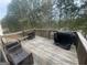 Outdoor deck offering a great space for relaxation and entertaining amidst a wooded view at 5470 Hilltop Pass, Fairburn, GA 30213