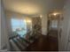 Bright dining room features a modern chandelier, table, and large windows at 5470 Hilltop Pass, Fairburn, GA 30213