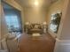 Cozy living room with neutral paint, plush furniture, and ample natural light at 5470 Hilltop Pass, Fairburn, GA 30213