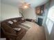 Inviting living room with a fireplace, plush seating, and an open layout at 5470 Hilltop Pass, Fairburn, GA 30213