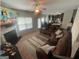 Spacious living room with a fireplace, comfortable seating, and an open view to the kitchen at 5470 Hilltop Pass, Fairburn, GA 30213