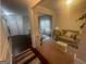 Open floor plan with living room, dining room, and hallway for modern living at 5470 Hilltop Pass, Fairburn, GA 30213