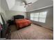 A carpeted main bedroom with a large window, ceiling fan and a tufted headboard at 5470 Hilltop Pass, Fairburn, GA 30213