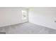 Cozy bedroom featuring carpeted floors and a window to let in natural light at 303 Limestone Circle, Conyers, GA 30013