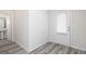 Bright entryway showcasing modern gray floors and a white door at 303 Limestone Circle, Conyers, GA 30013
