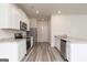 Stylish kitchen with white cabinets, granite countertops, and stainless steel appliances at 303 Limestone Circle, Conyers, GA 30013