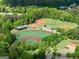 A beautiful aerial shot of the well maintained baseball fields with mature trees at 2100 Willshire Gln, Alpharetta, GA 30009