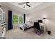 Comfortable bedroom with a ceiling fan, natural light, and a dedicated workspace, perfect for relaxing and working at 2100 Willshire Gln, Alpharetta, GA 30009