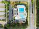 Top-down aerial view of the community pool with an expansive parking area at 2100 Willshire Gln, Alpharetta, GA 30009
