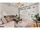 Cozy living room boasting custom built-ins, coffered ceilings, comfortable seating, and a large decorative rug at 2100 Willshire Gln, Alpharetta, GA 30009