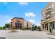 Charming town square featuring brick buildings, landscaped circle, and inviting gathering spaces under a clear sky at 2100 Willshire Gln, Alpharetta, GA 30009