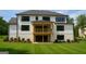 A well-maintained backyard features a covered patio and a spacious lawn at 2868 Octavia Cir, Marietta, GA 30062