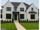 Charming white two-story home with a well-manicured lawn and black window trim at 2868 Octavia Cir, Marietta, GA 30062