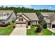 An elevated view of a lovely two-story home with an attached two-car garage, landscaping, and driveway at 123 Mulberry Ct, Peachtree City, GA 30269