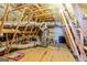 View of the attic with insulation and installed HVAC system with metal ducting at 123 Mulberry Ct, Peachtree City, GA 30269