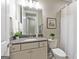 Bathroom with white cabinets, modern lighting, and framed artwork at 123 Mulberry Ct, Peachtree City, GA 30269