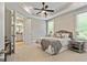 Relaxing bedroom with a ceiling fan and ensuite bathroom at 123 Mulberry Ct, Peachtree City, GA 30269