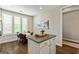 Inviting breakfast area with backyard views, next to a central kitchen island at 123 Mulberry Ct, Peachtree City, GA 30269