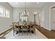 Bright dining room featuring a wooden table with seating for six at 123 Mulberry Ct, Peachtree City, GA 30269