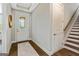 Welcoming entryway features hardwood floors, decorative glass door, and staircase leading to the upper level at 123 Mulberry Ct, Peachtree City, GA 30269