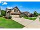 Charming home featuring a well-maintained lawn, driveway, and two-car garage at 123 Mulberry Ct, Peachtree City, GA 30269