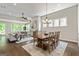 Open concept living and dining area with hardwood floors and lots of natural light at 123 Mulberry Ct, Peachtree City, GA 30269