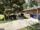 Backyard featuring a walkway, landscaping, and a bench at 2334 Connally Dr, East Point, GA 30344