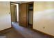 Spacious bedroom with neutral walls, plush carpet, and closet at 2334 Connally Dr, East Point, GA 30344