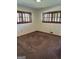 Bedroom with carpet and natural light from shuttered windows at 2334 Connally Dr, East Point, GA 30344