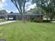 Charming brick home featuring a well-maintained lawn and covered parking at 2334 Connally Dr, East Point, GA 30344