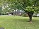 Charming brick home featuring a well-maintained lawn and covered parking at 2334 Connally Dr, East Point, GA 30344