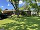 Charming brick home featuring a well-maintained lawn and covered parking at 2334 Connally Dr, East Point, GA 30344