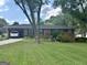 Charming brick home featuring a well-maintained lawn and covered parking at 2334 Connally Dr, East Point, GA 30344
