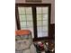 Room with French doors and view to outdoors, a chair and a lawnmower at 2334 Connally Dr, East Point, GA 30344