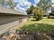 One-story outbuilding with beige siding and brown trim, complemented by a lush green lawn at 2334 Connally Dr, East Point, GA 30344