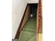 Carpeted stairway with wood railings at 2334 Connally Dr, East Point, GA 30344