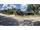 A wide street view showcasing the property and its relation to neighboring houses at 2334 Connally Dr, East Point, GA 30344