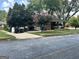 View of the property's frontage and the nearby street, framed by trees at 2334 Connally Dr, East Point, GA 30344