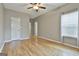 Bright bedroom with hardwood floors and recessed lighting offers ample space and natural light at 508 Las Brasis Ct, Peachtree City, GA 30269