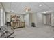 Finished basement bedroom with ceiling fan, bed, natural light, neutral colored walls, and carpet at 508 Las Brasis Ct, Peachtree City, GA 30269
