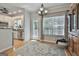 Light-filled dining area with backyard views, hardwood flooring, and access to the kitchen at 508 Las Brasis Ct, Peachtree City, GA 30269
